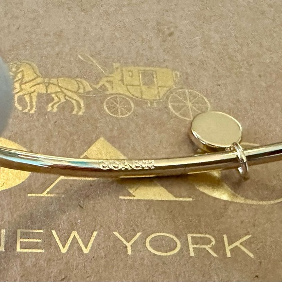 Coach Gold-tone Skinny Bangle Bracelet with White Enamel Signature C Charm - Picture 6 of 6